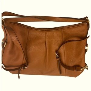 Never worn Vince Camuto leather shoulder bag
that can also double as backpack!